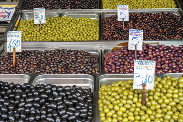 Containers with Greek green olives in the market, Athens, Greece.