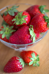 Fresh strawberries on old wooden background
