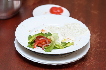 Dirty dishes on the table in the room after a vegetarian meal.