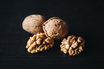 Walnuts kernels    with color background, Whole walnuts in wood vintage bowl. rustic