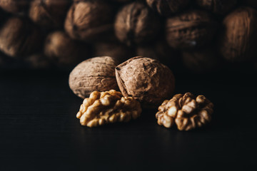 Walnuts kernels    with color background, Whole walnuts in wood vintage bowl. rustic