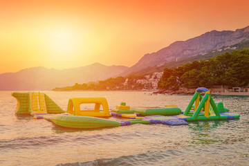 water park on the sea by sunset