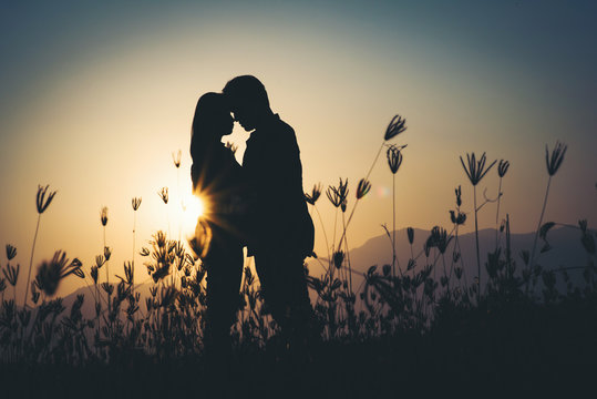 silhouette of Couple in love silhouette during sunset