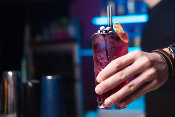 alcoholic drink in hand