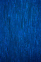 Fototapeta na wymiar Dark blue and blue background smeared with brushes.