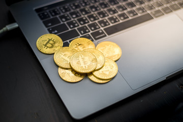 Bitcoin coins on a laptop  keyboard