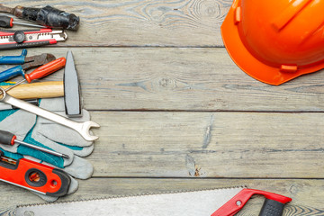 Assorted work tools on wooden table