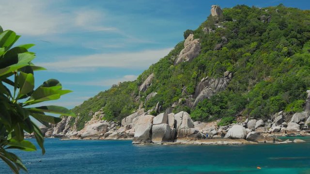 Tanote Bay on sunny day. Blue bay and huge granite rocks. Koh Tao, Thailand
