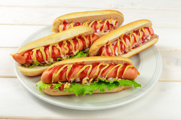 Hot dogs on wooden background