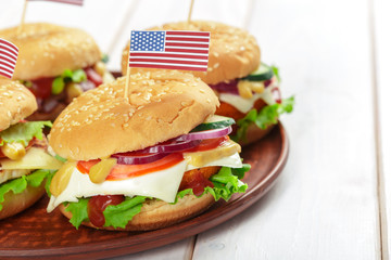 Fast food, homemade burger on a wooden background
