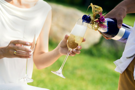 in the street champagne is poured glasses