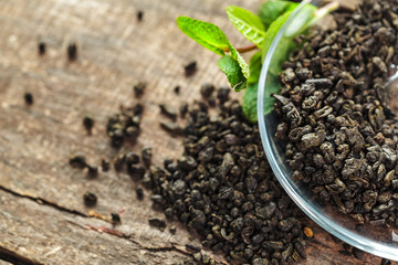 Dry tea on wooden table background