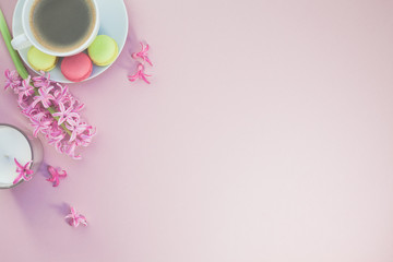 Flat lay photo of coffee cup with flowers