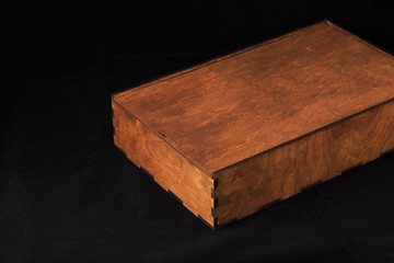 Wooden box on a black background, wooden texture