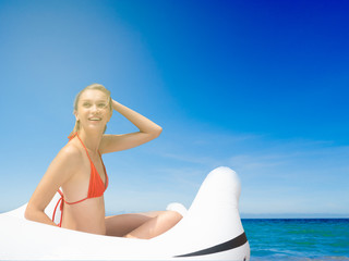 bikini girl in the sea with blue sky