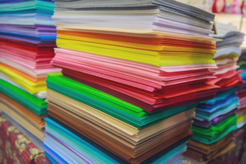 Multicolored paper for creativity on the counter of the store. Scrapbooking
