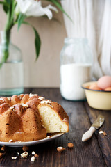 Homemade vanilla cake with glaze and nuts
