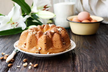 Homemade vanilla cake with glaze and nuts
