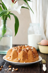 Homemade vanilla cake with glaze and nuts
