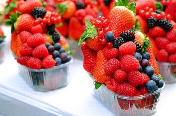 Basket with fresh strawberry, blackberries, blueberries, raspberries and red currant.