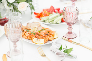 Fish platter. Plate with seafood on the table, snacks at the banquet, wedding banquet, table setting, dinner food, gala dinner.