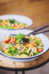 Green Goddess Buddha Bowl on wooden table. Healthy eating, food photography concept. Copy space, vertical