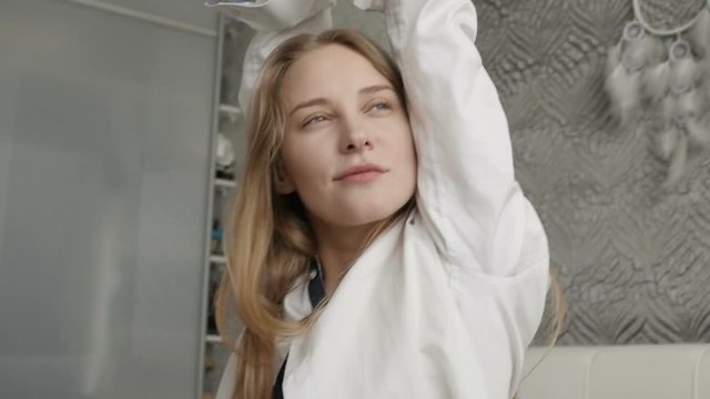Glamourous irl is stretching on the bed