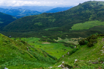 landscape on mountains and grassy valley