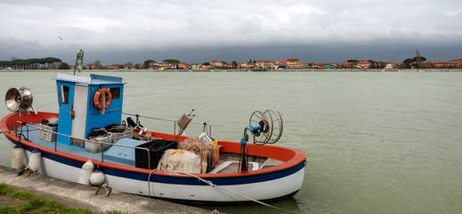 Fototapeta na wymiar Fishing Boat in the Magra River - Italy
