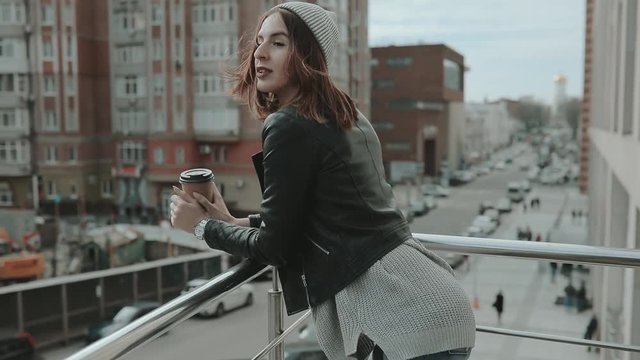 Street style, woman drink coffee in city