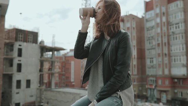 Street style, woman drink coffee in city