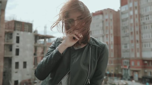 Rocker woman portrait in a windy city