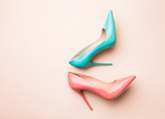 Set of colored women's shoes on pink background