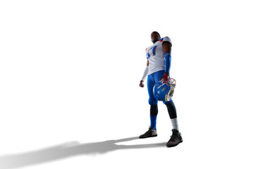 Fototapeta na wymiar Isolated Black American football player in white background