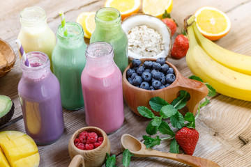 Purple and light red fresh smoothie with coconut sugar, blueberry, fruits, oats and seeds, selective focus. Clean eating, detox, dieting, vegetarian, vegan, fitness, healthy lifestyle concept, 