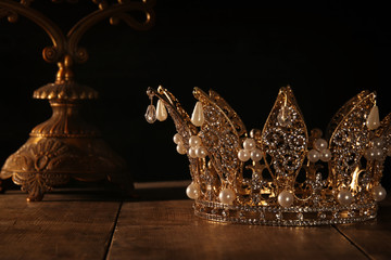 low key image of beautiful queen/king crown. fantasy medieval period. Selective focus.