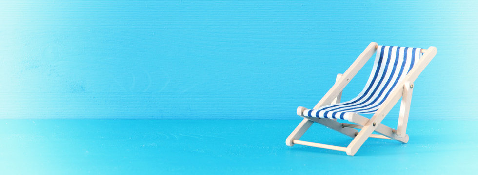 image of beach chair over blue background.