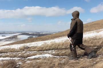 Nordic Walking -  adult man descending from the mountain Bald, Bugotaksky hills, Novosibirsk...