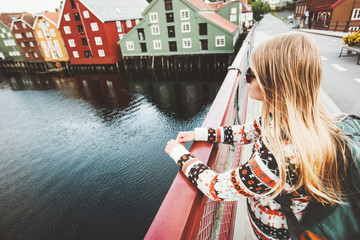 Young woman sightseeing Trondheim city from bridge in Norway Lifestyle vacations outdoor...