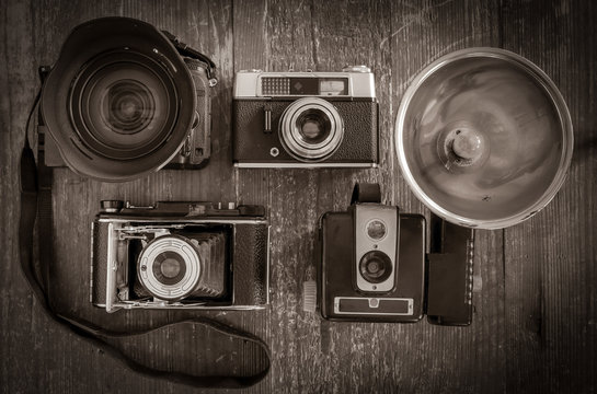 Selection of vintage film cameras with one modern DSLR