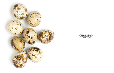 Quail eggs on white background, with space for text.