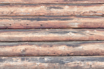 Wall of old logs. Horizontal arrangement. Close-up