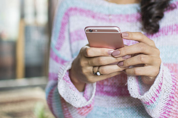 Close up of a woman with a smartphone