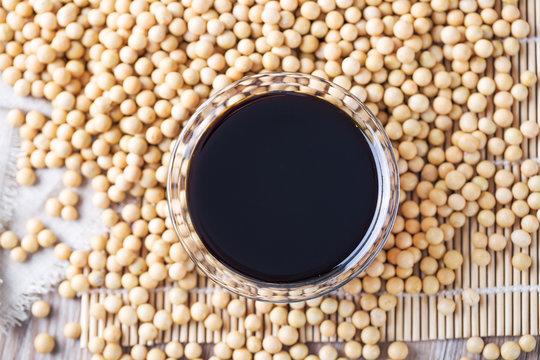 Top view of soy sauce and beans