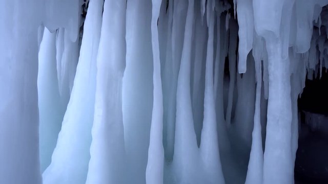Dolly Front white ice splashes inwards Sharp pillars blue glacier frozen cave cliff details Beautiful Abstract. Grown natural Intact innocent. Arctic North Baikal. Winter cold icy frozen. Gimbal 