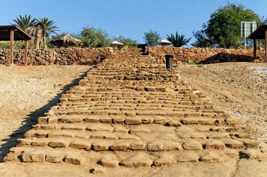 Old long staircase of roughly hewn sandstones leading to the beach of the Dead Sea in Jordan