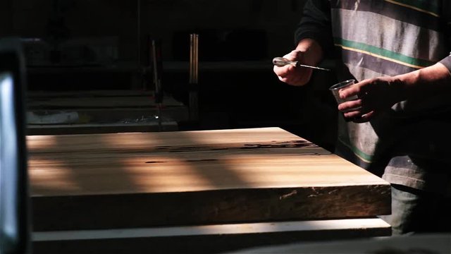 Handmade work on the manufacture of furniture from wood. epoxy in the cracks.