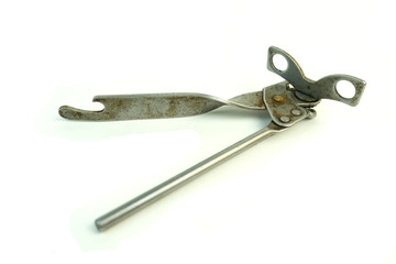 Old can opener. Photo on white background.