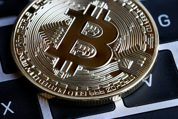 Bitcoin Cryptocurrency is modern of Exchange Digital payment money,Gold Bitcoins circuit with B letter symbol on keyboard. Cryptocurrency can uses digital currencies, virtual currencies on web markets