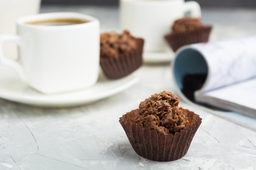 Chocolate candies with nuts and shinning topping